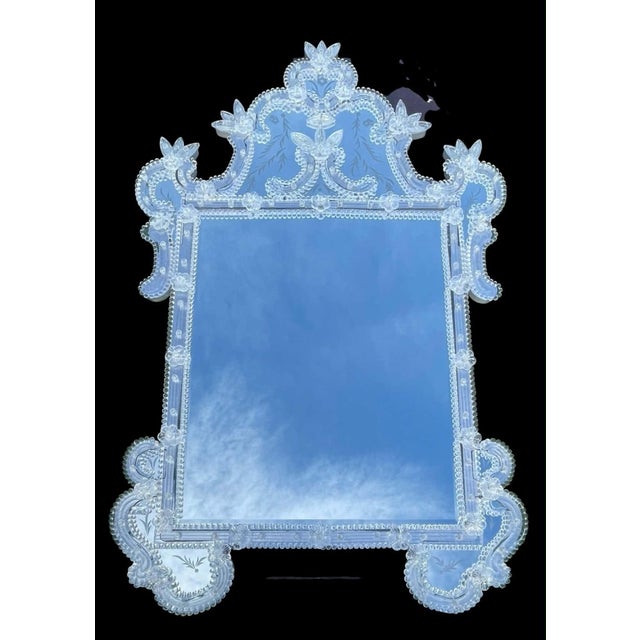 Luxurious Vintage Venetian Mirror. Beautiful reversed etching on top and bottom portions. Two pieces were repaired in the...