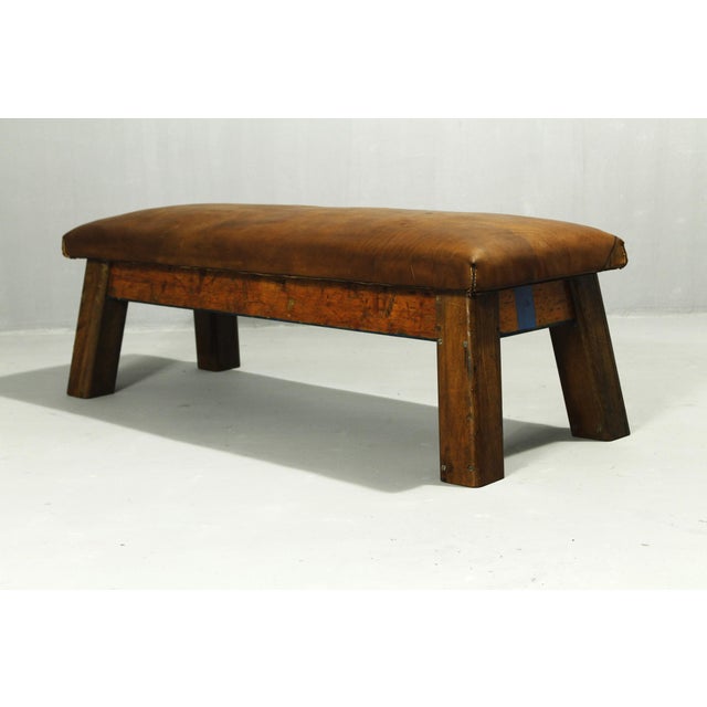 Leather gymnastics bench from the 1950s, made of cowhide in very good condition. Beautiful patina.