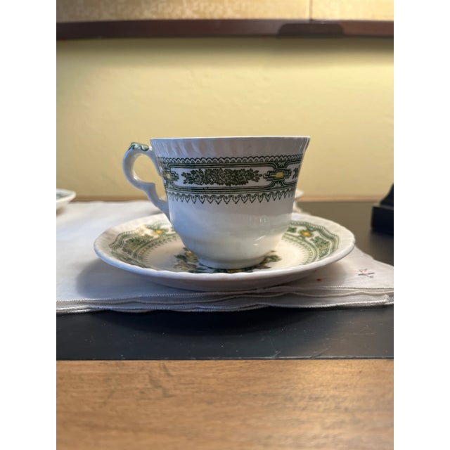 Mason’s Ironstone Manchu green 4 flat cup and saucer sets. Made in England. The cup has a height of 2.875” and a width of...