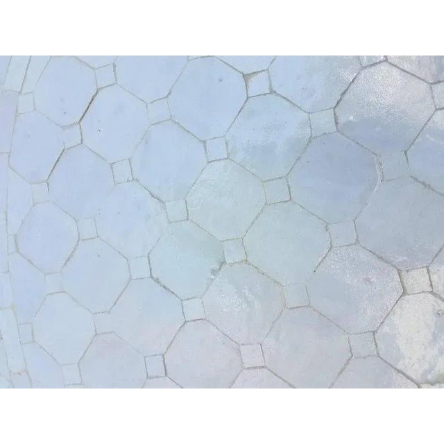 Custom made glazed Moroccan mosaic table measuring 48" in diameter. White is the color. An indoor or outdoor dining table...