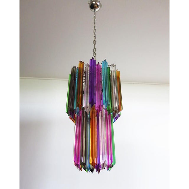 Fantastic vintage Murano chandelier made by 46 Murano crystal multicolored prism in a nickel metal frame. Period: late XX...