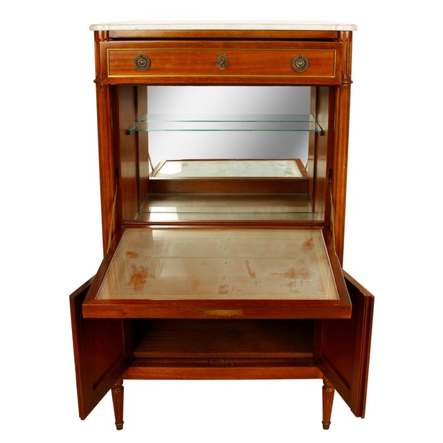 Louis XVI style marble top secretary or bar with brass fittings. A top center panel hinges open to reveal surface for...