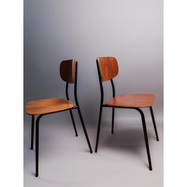 Set of 2 teak wooden chairs from the 1960s Mid-century Scandinavian design Beautiful minimalist industrial design with...