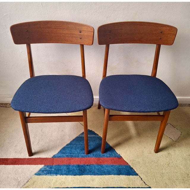Finely constructed pair of Danish dining chairs by Farstrup Mobler in teak and beech, seats recently re-covered with a...
