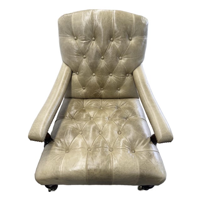 George Smith Edwardian Style Chairs in a muted olive green tone tufted leather on turned mahogany legs with brass casters....