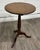 This is a stunning antique 19th century mahogany tilt-top tea or occasional table featuring a round top, turned pedestal...