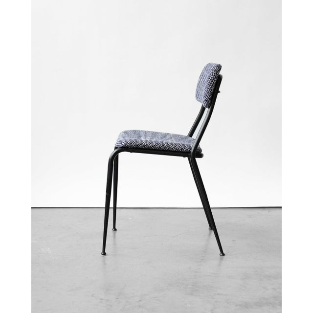 This vintage chair from the 1960s has been reupholstered in a high-quality Italian fabric. It features a sturdy metal...