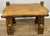 A distinctive Vintage leather footstool , combining rustic charm with striking decorative brass elements and a beautifully...