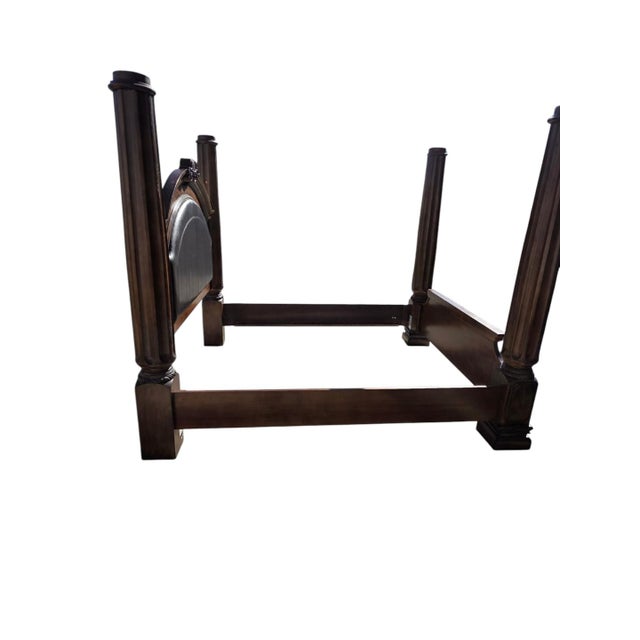 Elegant and substantial king-size four poster bed featuring tall fluted columns and rich wood finish. Classic proportions...