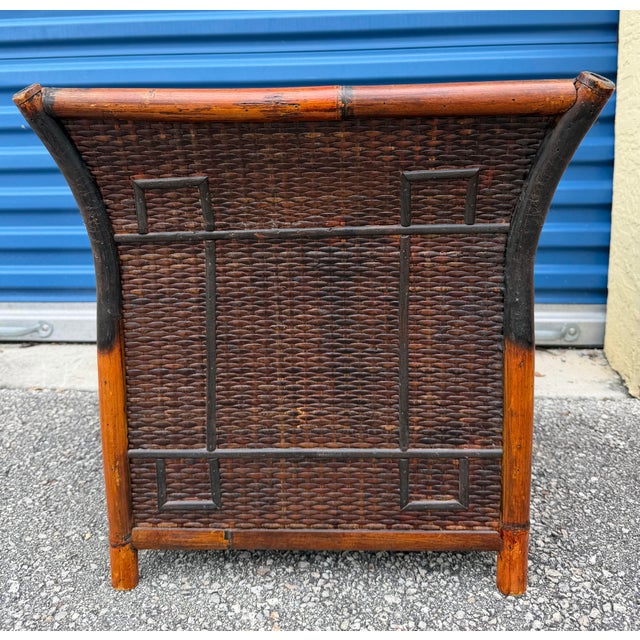 Extra large vintage French tortoise rattan planter featuring a curved, flared shape and thick bamboo trim with nice detail...
