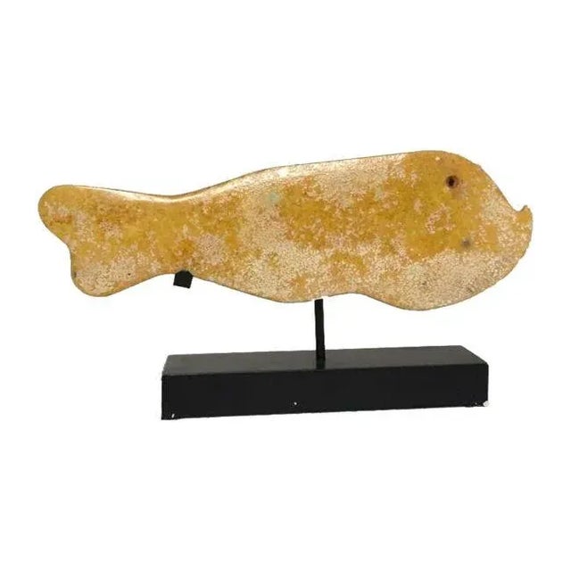 Enhance your home with the timeless elegance of this Mid-Century Vintage Amber Stone Jade Fish with Base. Crafted from...