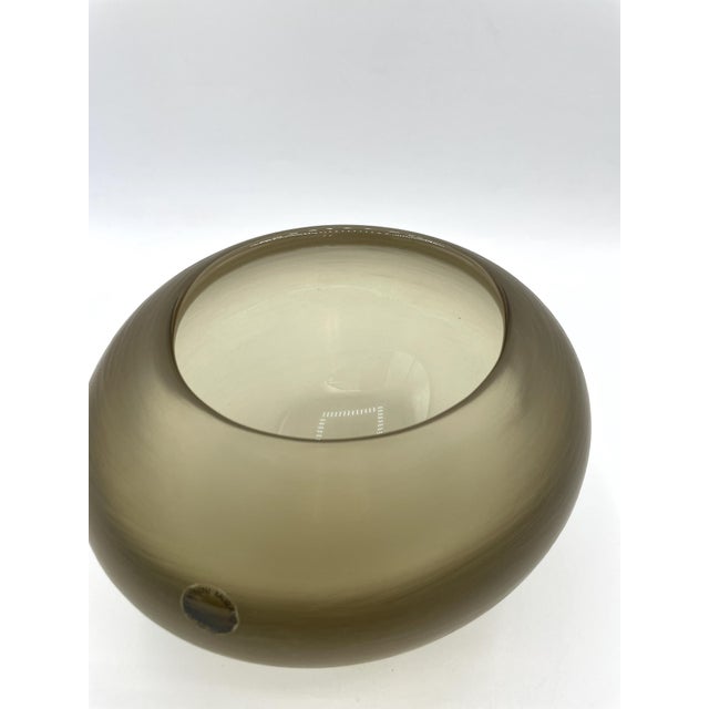 Oval vase with rounded shoulders in heavy iron gray glass, featuring overlapping colors. The vases from Paolo Venini's...