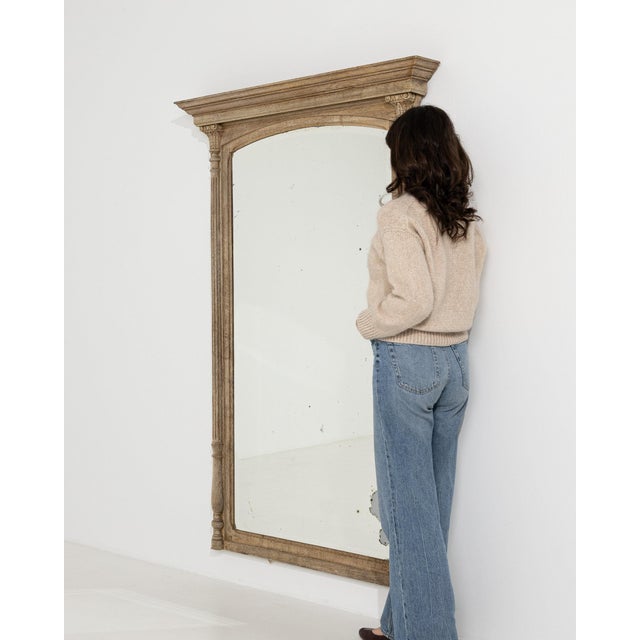 This mirror makes its impression through natural weathered oak, turned column. Originating in France during 1910s, it...