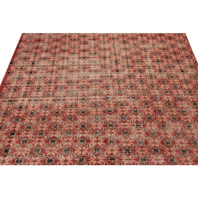 This vintage rug is a 5x8 Turkish distressed piece, made with hand-knotted wool circa mid-20th century. It is an exciting...