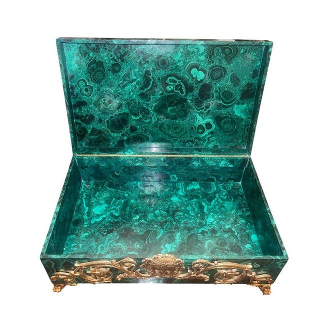An exceptional and highly decorative Russian malachite and gilt bronze decorative box, dating to the early 20th century...