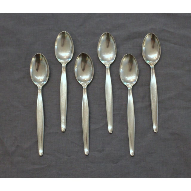 Mid-Century Modern 31-piece sterling silver flatware set by Towle. Contour designed in 1950 by Robert J. King and patented...