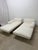 Pair of Let It Be daybeds with downfilled Italian fabric off-white with a slight cream tone cushions on a leather wrapped...