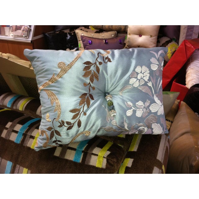 A wonderful design combining elegantly embroidered rococo arabesques in gold thread with soft embroidered blooms on silk....