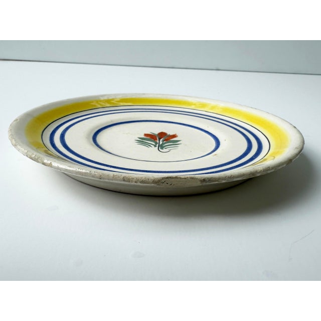 Antique plate with hand painted flower. Marked "Henriot Quimper France 724"