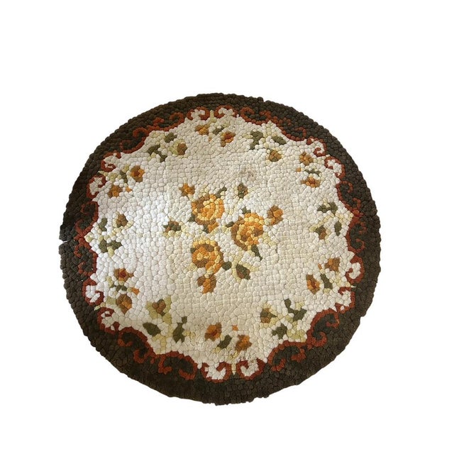 Add a touch of retro charm to your home with this vintage 70s rug. Featuring a classic floral pattern in warm shades of...