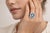 Elegant 14K white gold ring featuring a striking emerald cut aquamarine center stone weighing approximately 4.00 carats,...