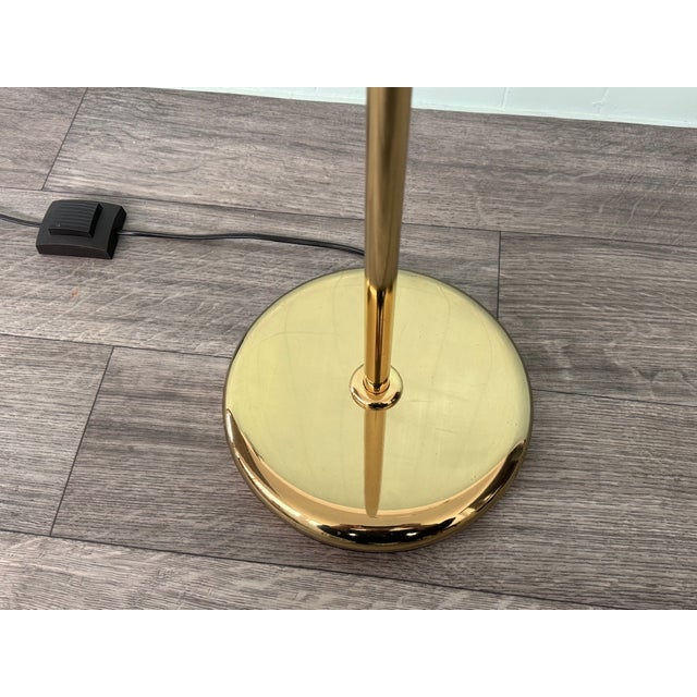 CERVA Italian adjustable floor lamp produced in the 80s. Single light lamp. stem and base in brass-plated metal. Foot...
