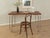 Classic desk from the 1960s with a table top in teak veneer with solid wood edges and a new stainless steel legs in...