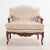 The arched flat back flanked by padded armrests on curved and carved supports, above shaped seat rails conformingly carved...