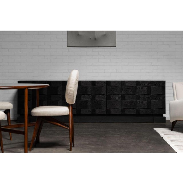 A rare and masterfully crafted example of 1970s Belgian brutalist design, this graphic-paneled sideboard by Maison Aurora...