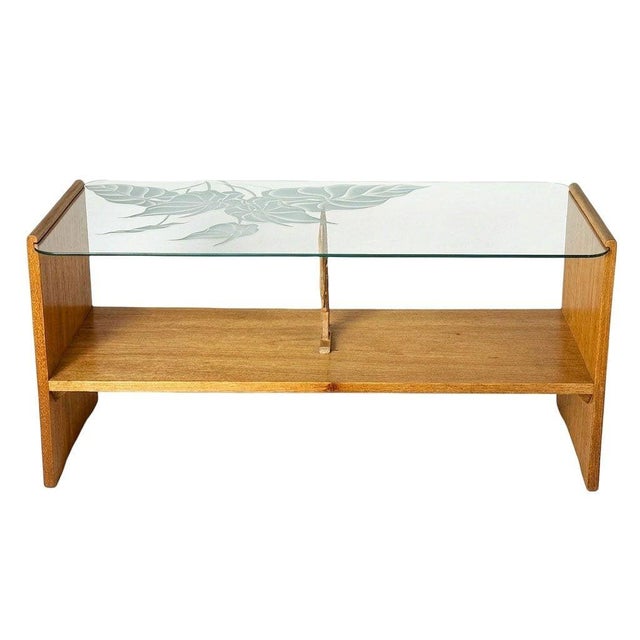 This beautifully restored 2-tiered coffee table is crafted from hand-carved Philippine mahogany (Toona Calantas) featuring...