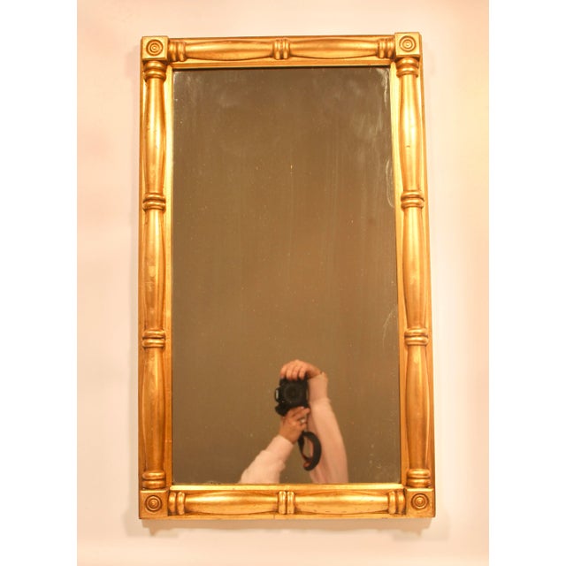 A radiant Antique French Wall Mirror, circa 1920s. This is a stunning large size mirror with bright and beautiful gold...