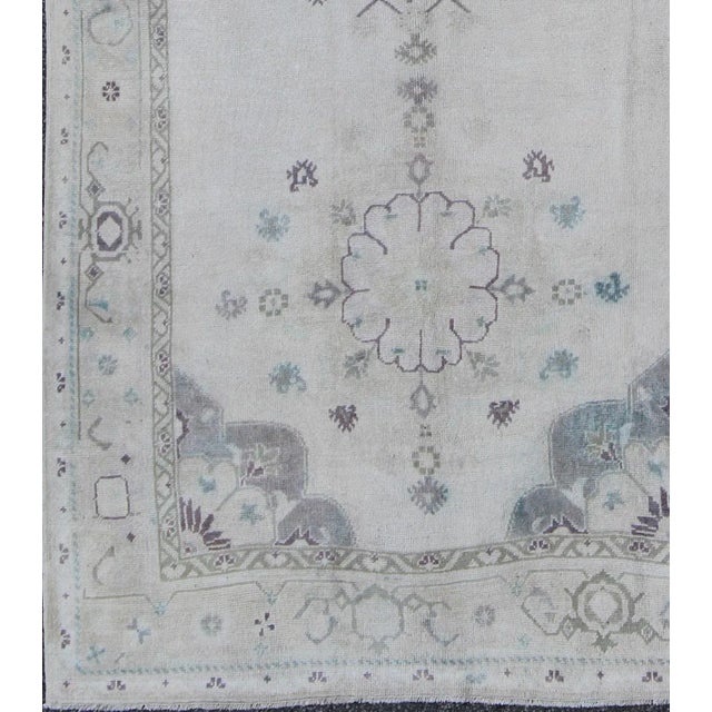 Measures: 5'1 x 10'9. Vintage Oushak Gallery Rug in Soft Gray, Ivory, and Hints of Blue Accents. Keivan Woven Arts / rug...