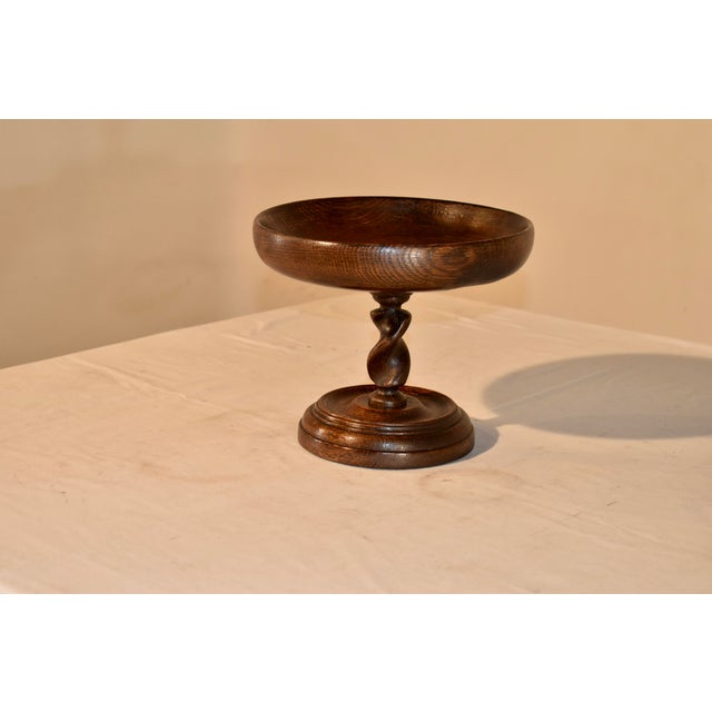 Circa 1900 oak footed compote from England. The bowl is nicely turned and sits atop a hand turned barley twist pedestal...