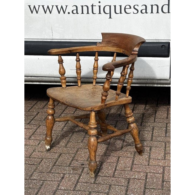 Antique Smokers Bow Fireside Chair. Sizes :- 79 cms tall, 69 cms wide, 45 cms seat height. Obviously an antique item, so...