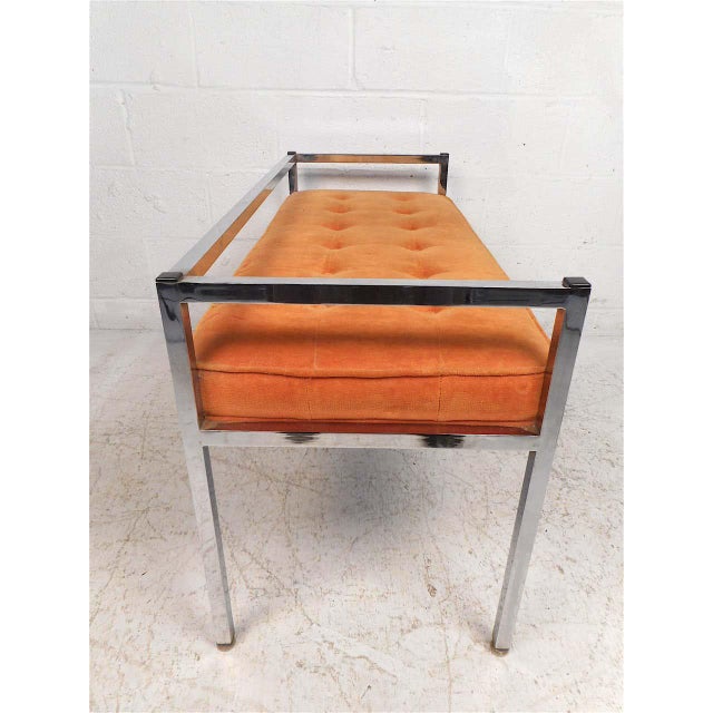 This stylish midcentury settee with a chrome frame. Seat is covered in a vintage tufted orange upholstery. Simplistic yet...