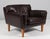 Illum Wikkelsø 1919-1999. Lounge chair, freestanding, upholstered in brown leather, loose cushions with down filling,...