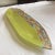 Contemporary lime and multi-colored boat-shaped art glass dish. Created in Canada.
