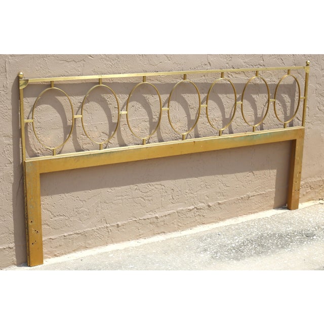 A vintage, brass and wood king-size headboard with a fretwork-type design incorporating seven ovals. Good vintage...