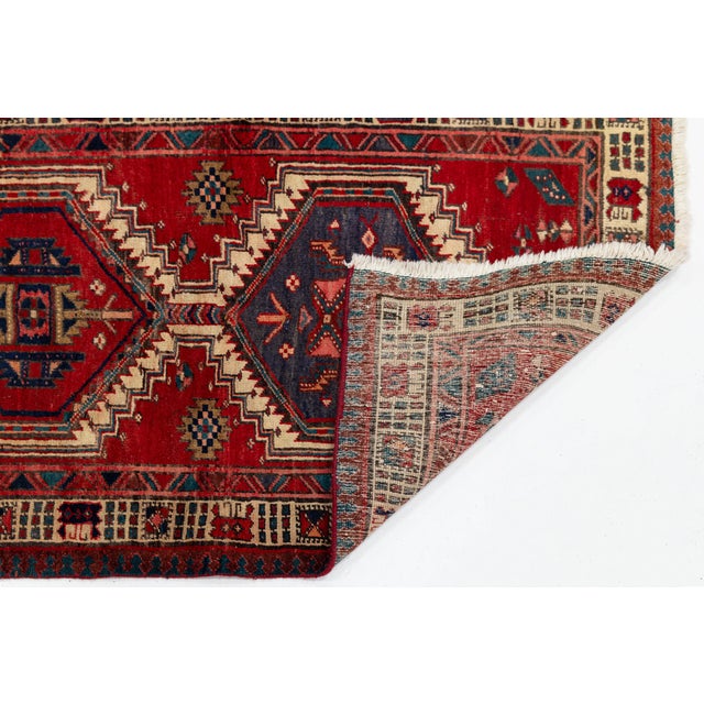 Elevate high-traffic hallways, gallery spaces, or entryways with this striking vintage hand-knotted Turkish wool runner...