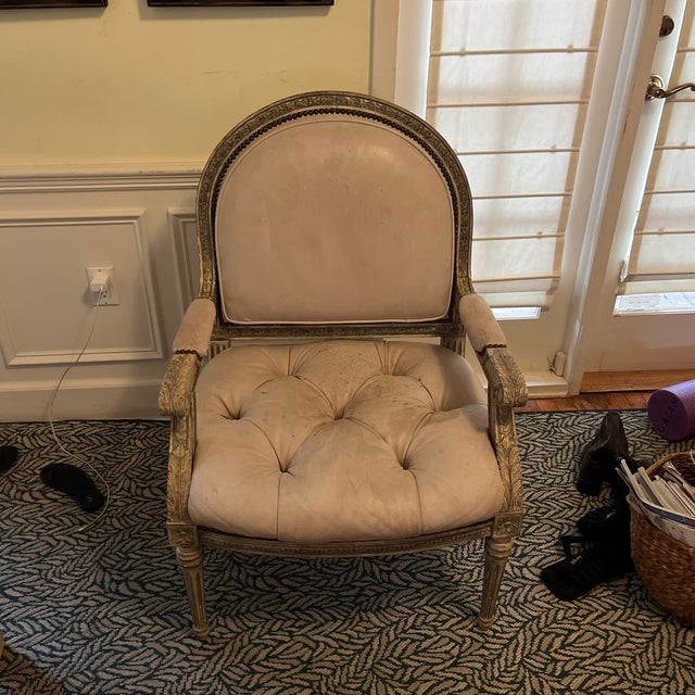 beautiful studded cream leather arm chair with dark brass studs and light grey wooden carved feather details. Some wear...