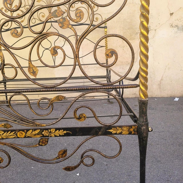 Very beautiful and rare iron bed painted brown-burgundy, with a very rich decoration of intertwined flowers and foliage,...