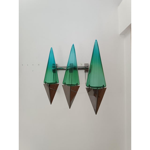 A striking and impressive wall sconce by guido de majo for de majo illuminazione. murano, italy, 1970s. a very rare piece...