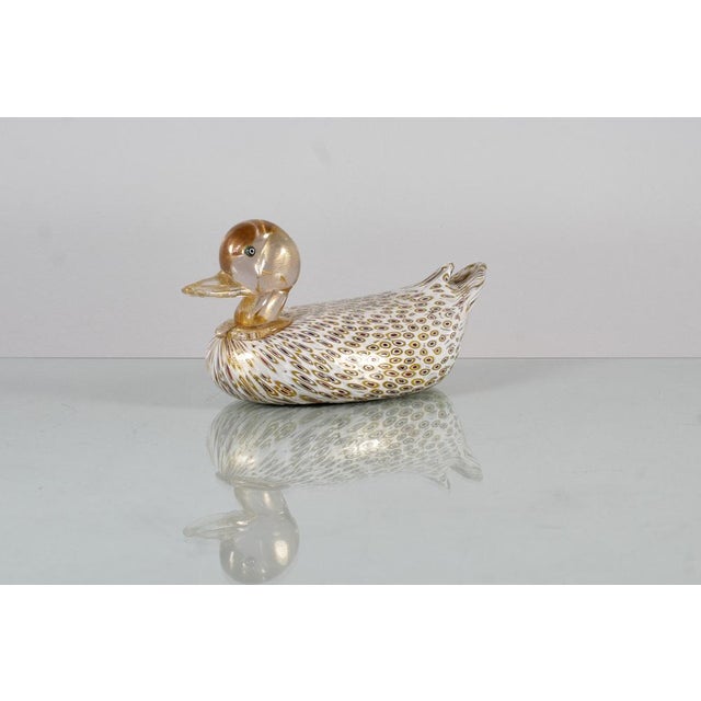 Murano glass sculpture attributed to Alfredo Barbini depicting a duck with milk glass body decorated with red and ocher...