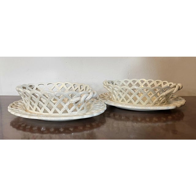 Fine and rare pair antique 18th century George III creamware chestnut baskets with underplates, circa 1790. Underplates...
