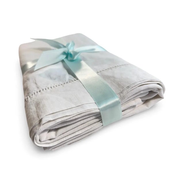 "Indulge in the quiet luxury of old-world France with this exceptional antique pillowcase, hand-stitched in pure natural...