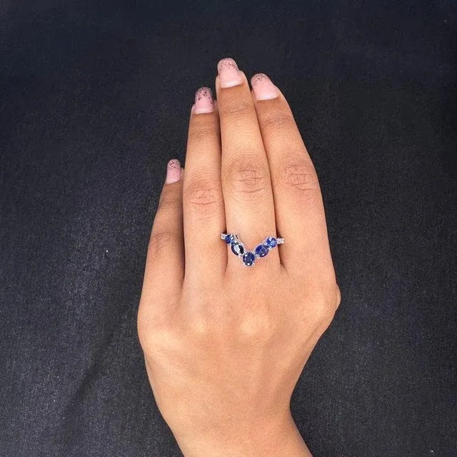 This is part of Chairish’s Fine Jewelry assortment. Blue Sapphire Chevron Ring With Diamonds in 14k Gold featuring natural...
