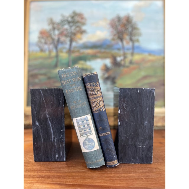 This handsome pair of vintage black marble colored bookends features a sleek, rectangular form and striking natural white...