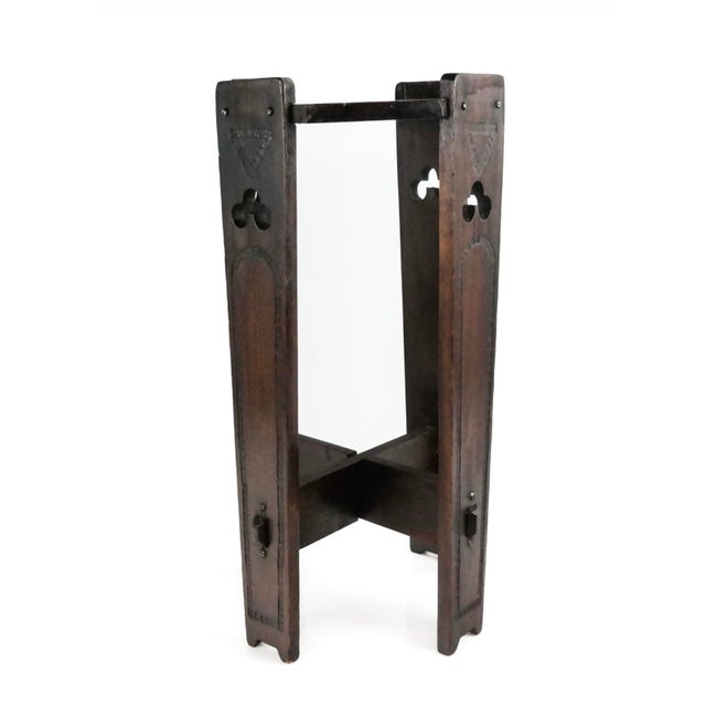 This is a lovely early 20th century English arts and crafts side table/ plant stand with an octagonal top and carved and...