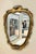 A beautiful vintage carved giltwood mirror attributed to Dorothy Draper. The distressed giltwood frame is accented with...