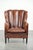 This unique sheepskin armchair features warm, deep colors, a comfortable seat, and is finished with black piping. The...